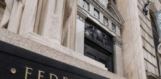 Federal Reserve officials project rate increases in 2023