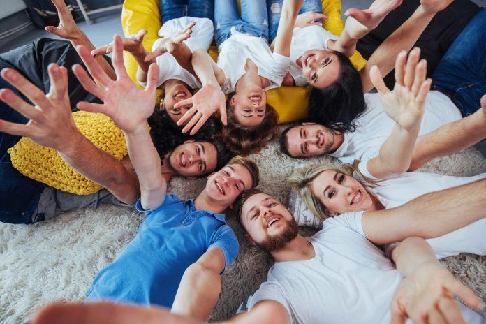 Group beautiful young people doing selfie lying on the floor, best friends girls and boys together having fun, posing emotional lifestyle concept