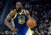 Draymond Green junto a los Warriors