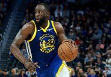 Draymond Green junto a los Warriors