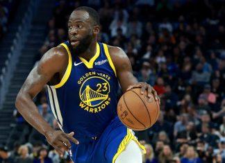 Draymond Green junto a los Warriors