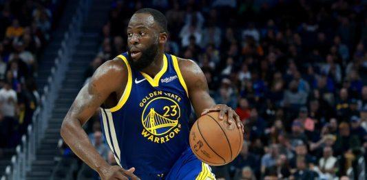 Draymond Green junto a los Warriors