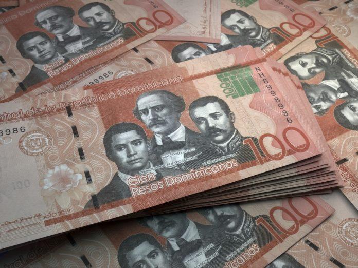 Dominican banknotes. Dominicanpeso bills. 100 DOP pesos. Business, finance background.
